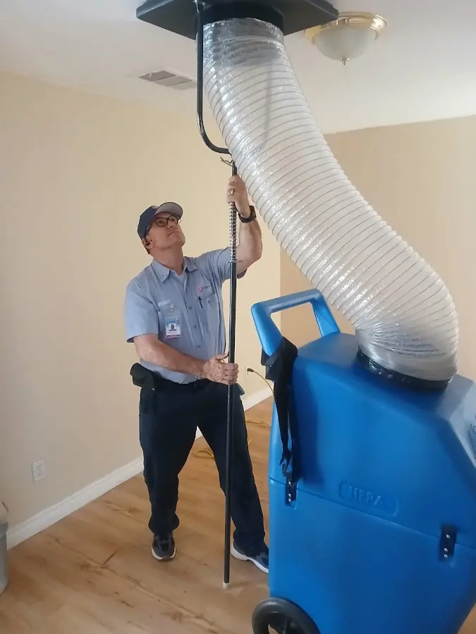 Furnace Tune-Up technician using HEPA equipment in Waco